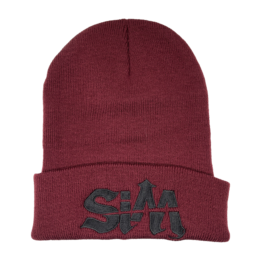 A maroon red beanie with embroidered SIM logo and bat design. 